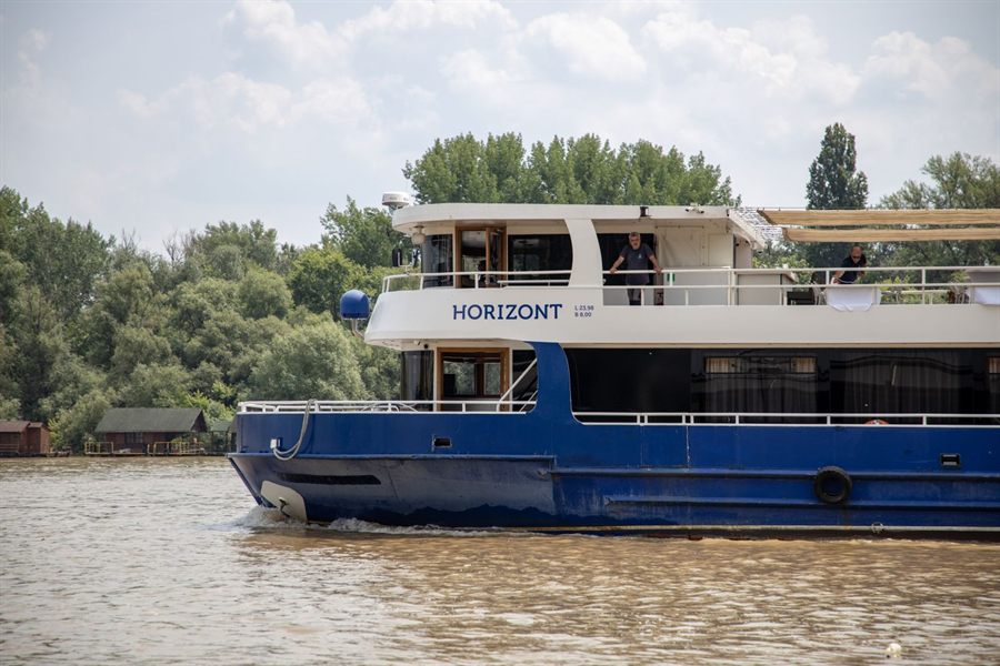 River passenger boat on a wooded river